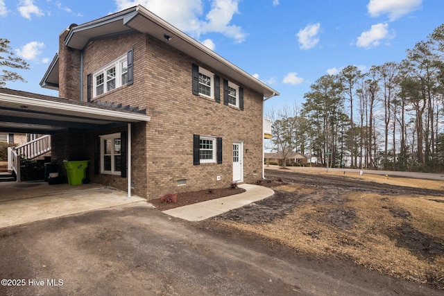 view of side of property with a carport