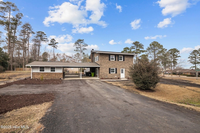 view of front of home featuring a carport