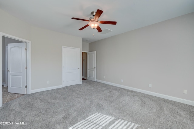 unfurnished bedroom featuring ceiling fan and light carpet