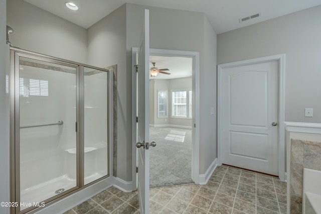 bathroom with tile patterned floors and a shower with shower door