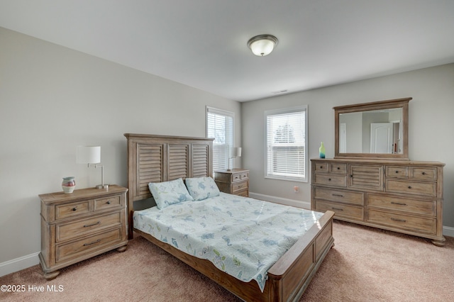 bedroom featuring light carpet