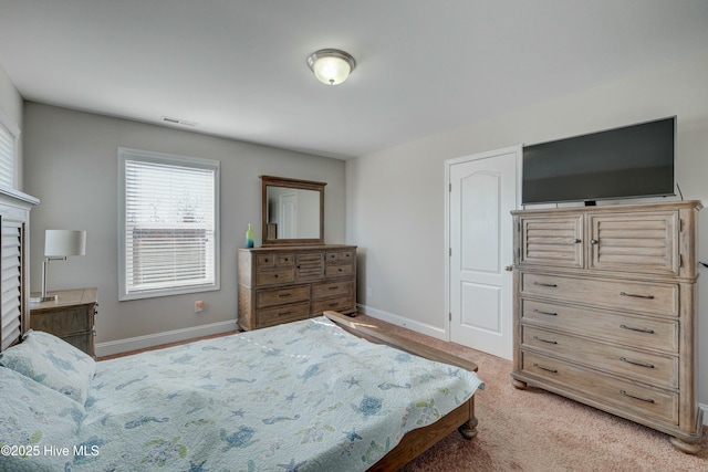 bedroom featuring light carpet