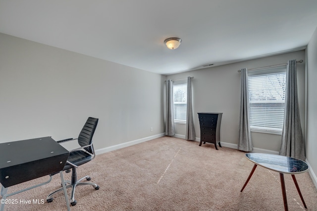 office area featuring light colored carpet