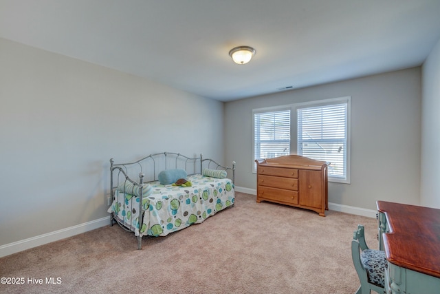 bedroom featuring light carpet