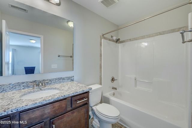 full bathroom featuring vanity, bathtub / shower combination, and toilet