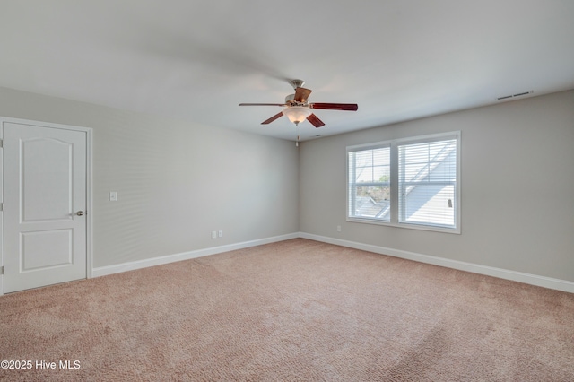 unfurnished room featuring ceiling fan and carpet flooring