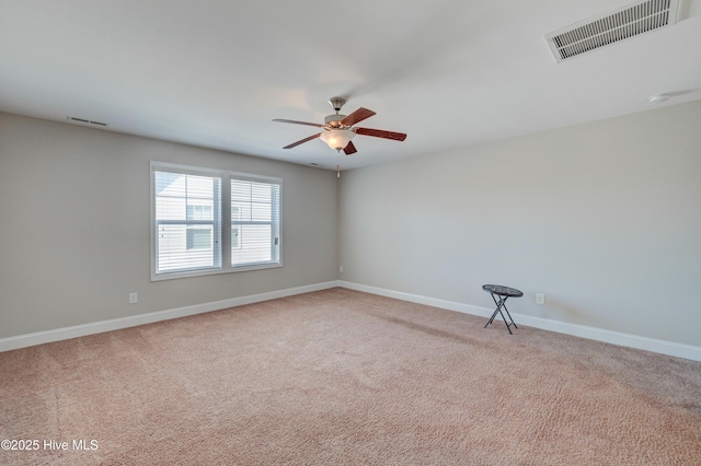 carpeted empty room with ceiling fan