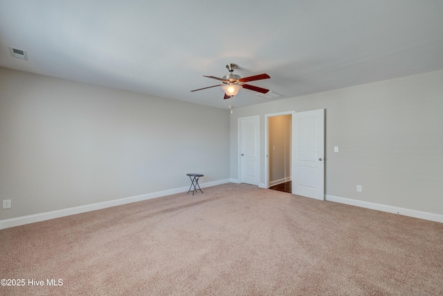 interior space featuring ceiling fan and carpet