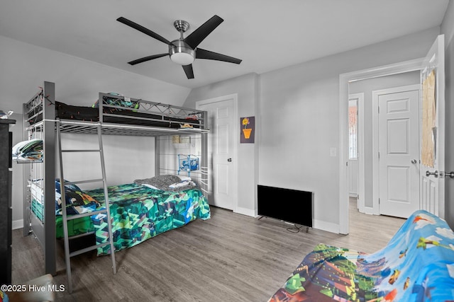 bedroom featuring hardwood / wood-style floors and ceiling fan