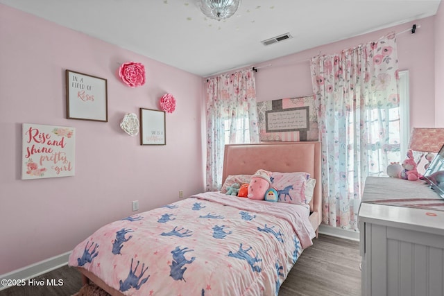 bedroom featuring dark wood-type flooring