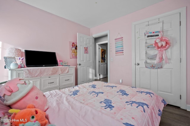 bedroom featuring dark hardwood / wood-style floors