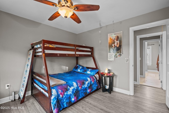 bedroom featuring hardwood / wood-style floors and ceiling fan