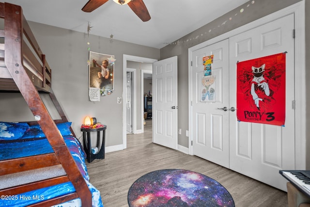 bedroom with ceiling fan and wood-type flooring