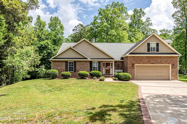 view of front of house with concrete driveway, a front yard, a garage, and brick siding