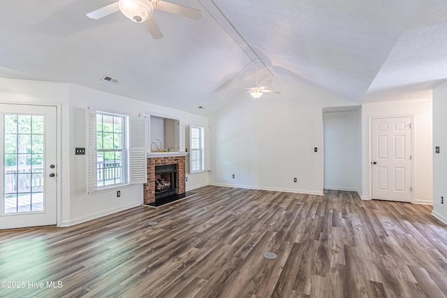 unfurnished living room with baseboards, vaulted ceiling, dark wood-style floors, visible vents, and a ceiling fan
