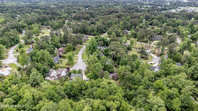 drone / aerial view featuring a view of trees