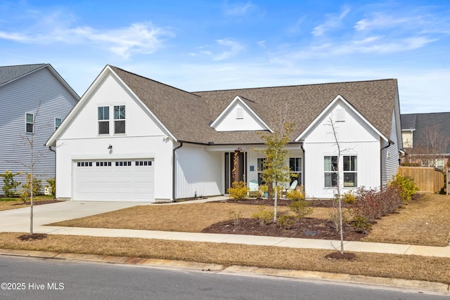 modern farmhouse style home featuring a garage, fence, concrete driveway, and roof with shingles