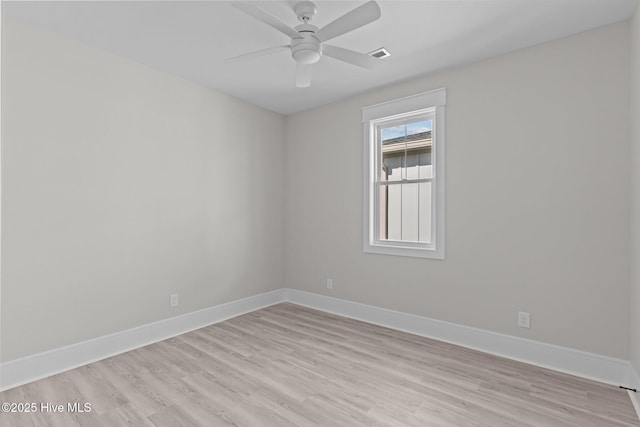 spare room featuring ceiling fan and light hardwood / wood-style flooring