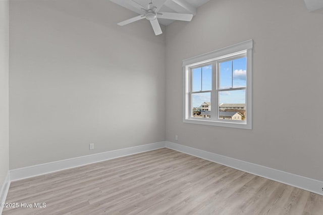 empty room with light hardwood / wood-style flooring and ceiling fan