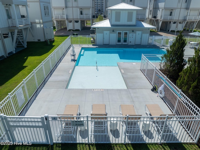 view of swimming pool with a patio area