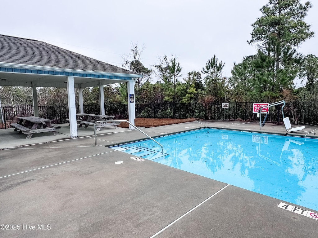 view of swimming pool featuring a gazebo and a patio area