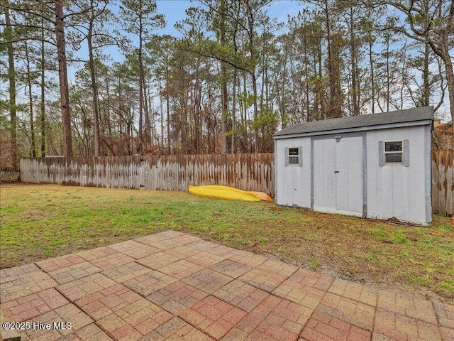 view of patio featuring a storage shed