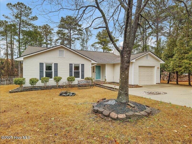 single story home with a garage and a front lawn