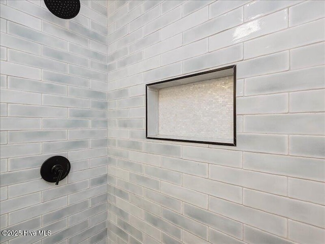 details featuring a tile shower