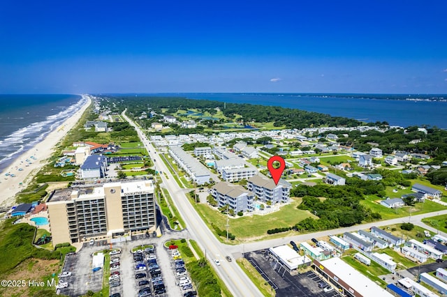 aerial view with a beach view and a water view