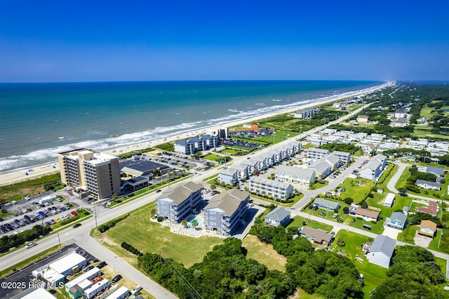 birds eye view of property featuring a view of the beach and a water view