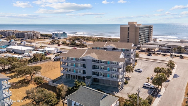 bird's eye view with a beach view and a water view