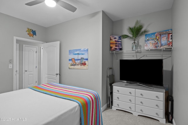 bedroom featuring ceiling fan and light colored carpet