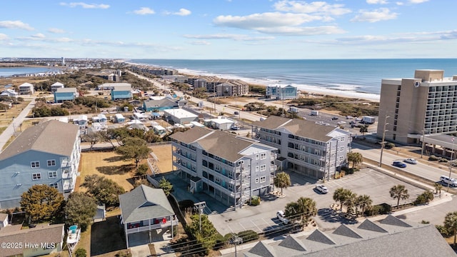 bird's eye view with a beach view and a water view