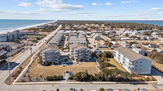 bird's eye view with a water view and a view of the beach