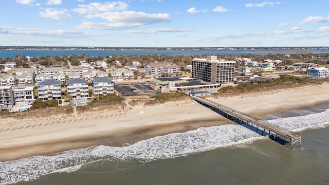 bird's eye view with a water view and a view of the beach