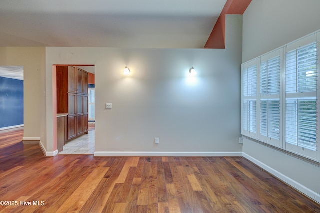 spare room featuring light hardwood / wood-style floors