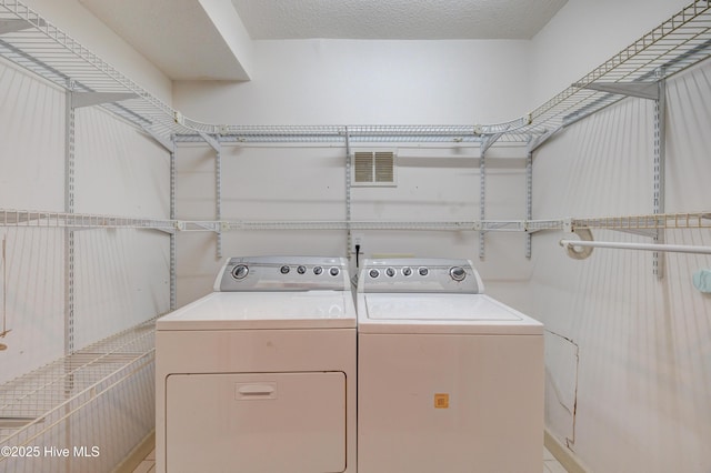 laundry room with separate washer and dryer