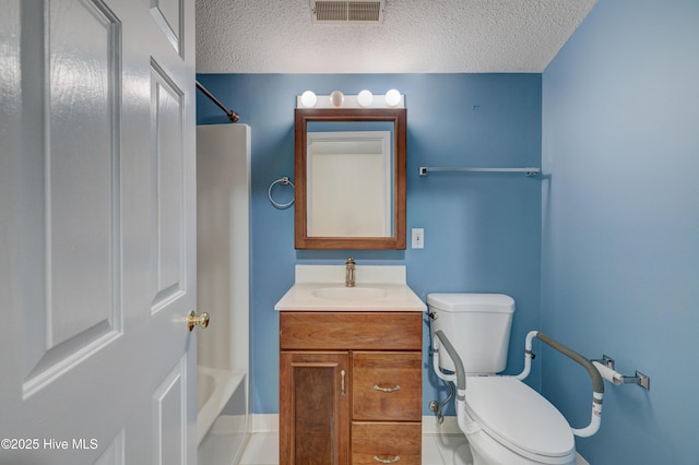 full bathroom with vanity, toilet, shower / bath combination, and a textured ceiling