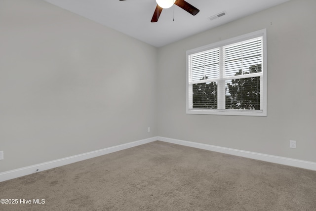 empty room with carpet floors and ceiling fan