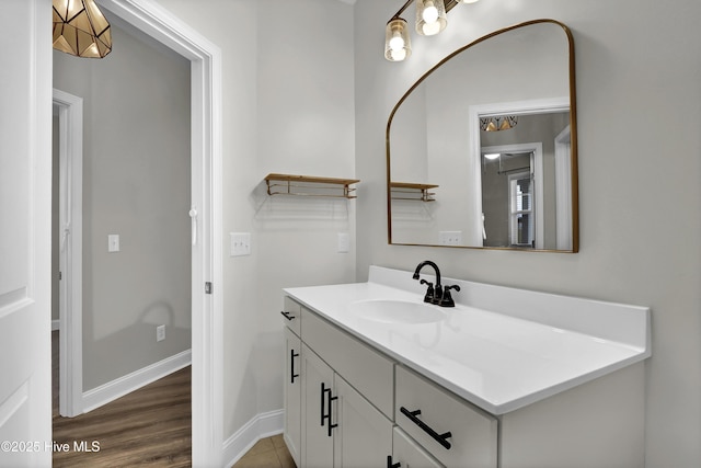 bathroom with hardwood / wood-style flooring and vanity