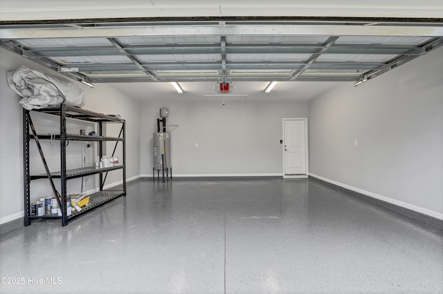 garage with a garage door opener and water heater