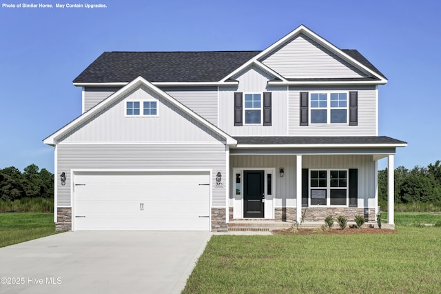 craftsman-style house featuring a garage, a front lawn, and covered porch