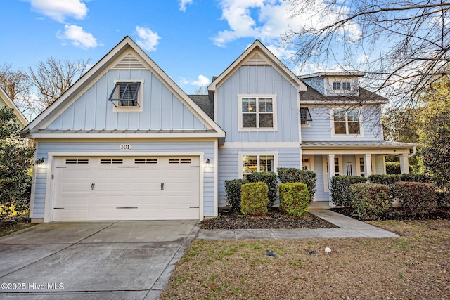 view of front of property featuring driveway, board and batten siding, and an attached garage