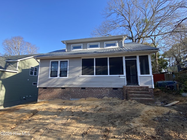 view of front of house featuring a sunroom