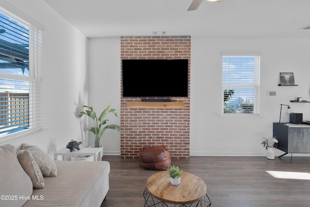 living room featuring hardwood / wood-style flooring and ceiling fan