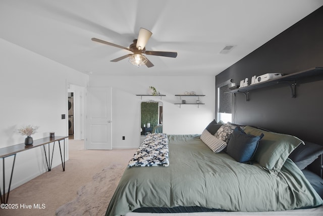 carpeted bedroom featuring ceiling fan