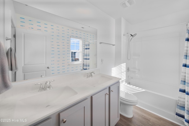 full bathroom with toilet, shower / bath combination with curtain, vanity, and wood-type flooring