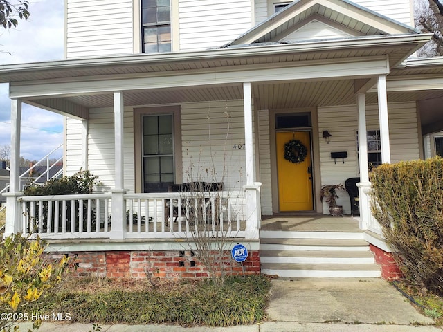 doorway to property with covered porch