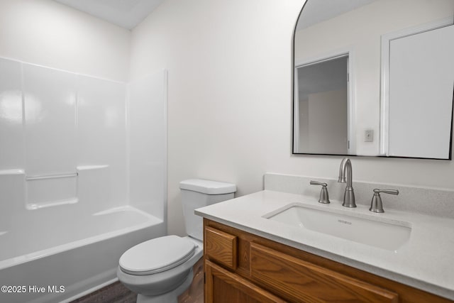 full bath featuring shower / washtub combination, vanity, and toilet