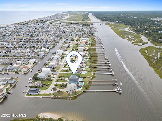 57 Craven St, Ocean Isle Beach, NC 28469 - aerial view of property's location featuring a large body of water and nearby suburban area
